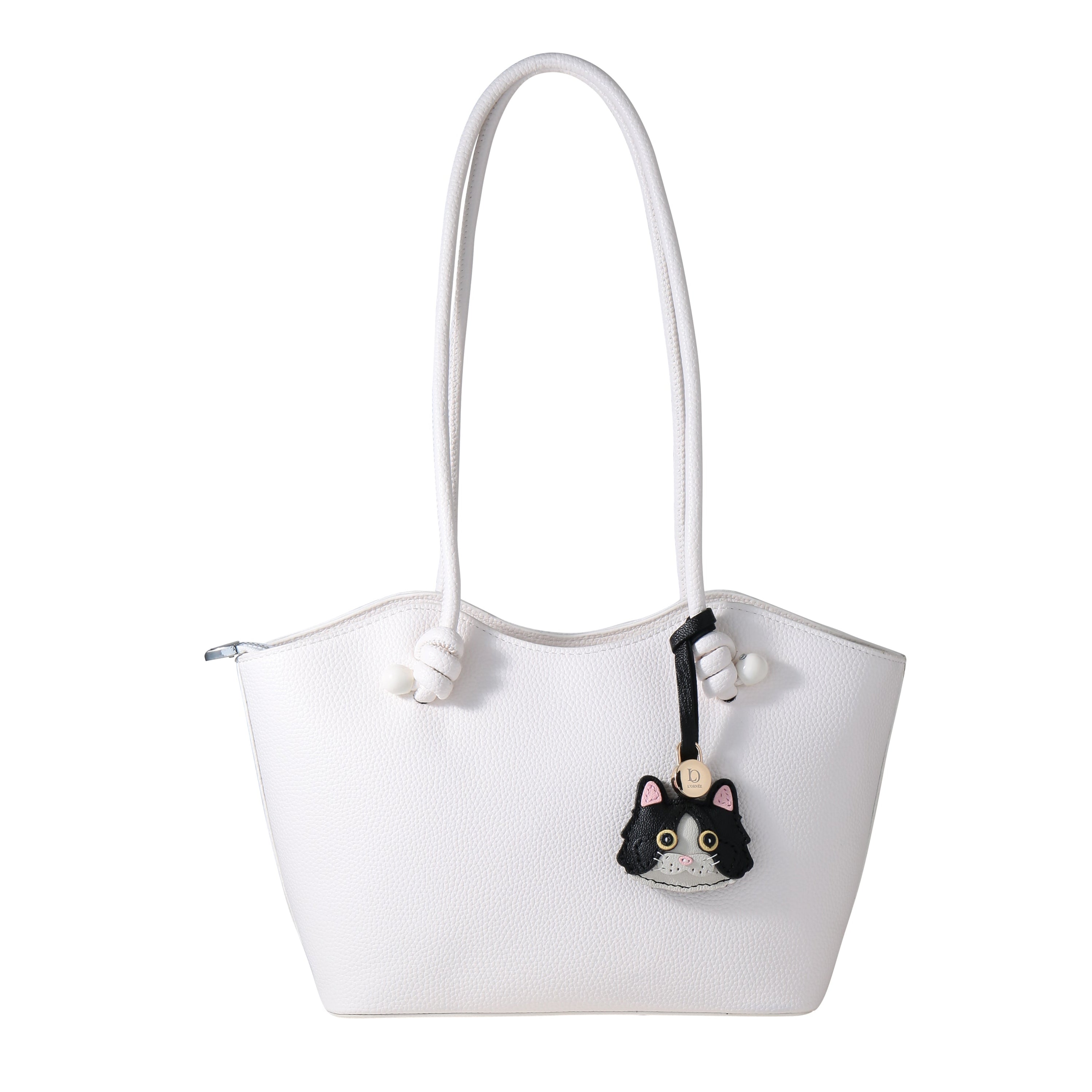 tuxedo cat with bag
