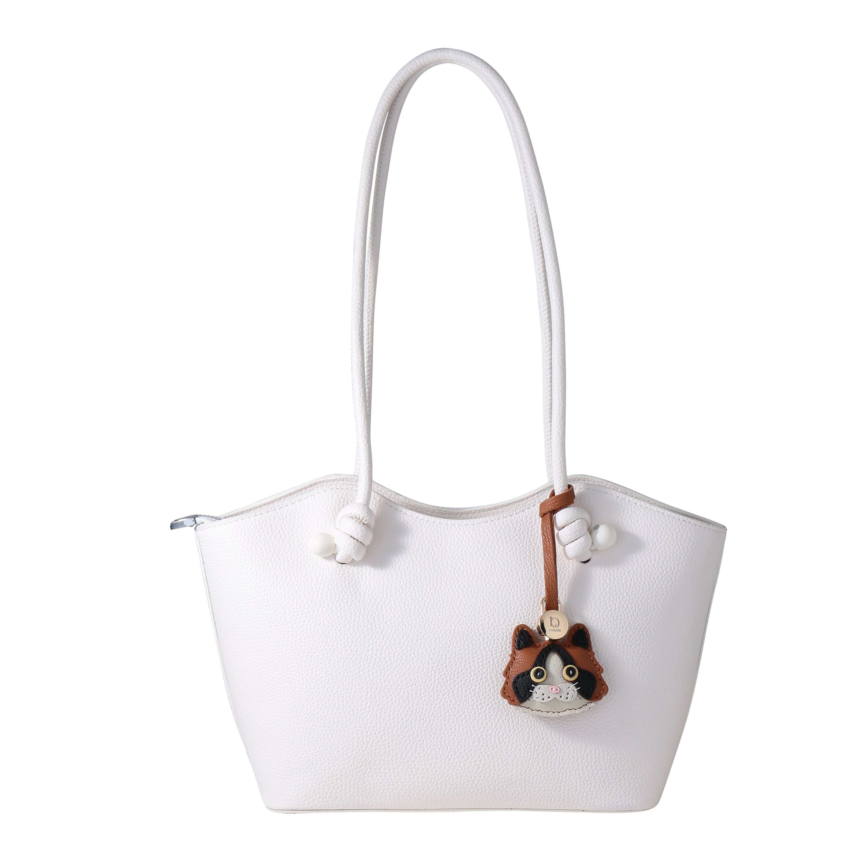 calico cat with bag