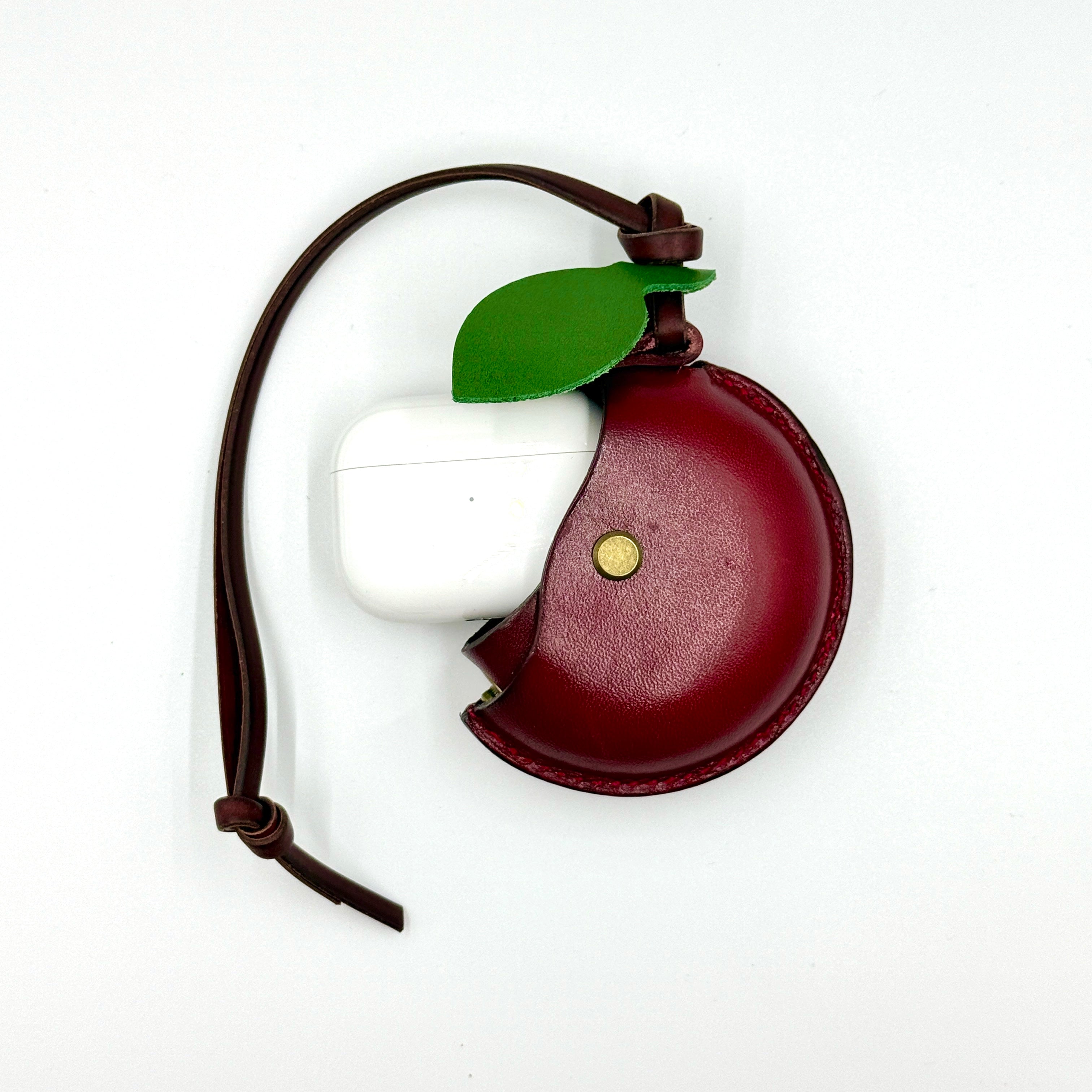 CHERRY AIRPOD CASE CHARM f	Product  shot  with airpod
